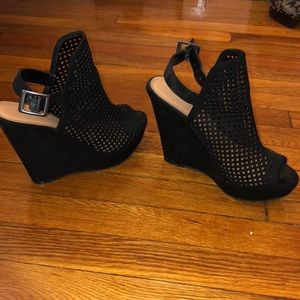 Perforated black suede wedges
